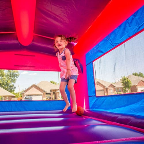 girl jumping in bounce house