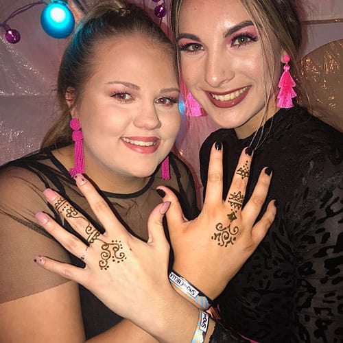 girls showing hand tattoos