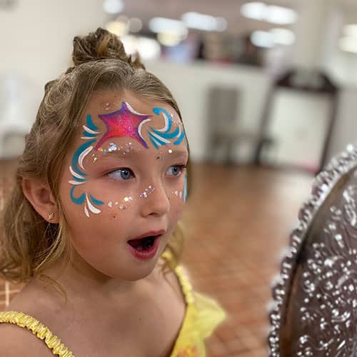 girl surprised by face paint