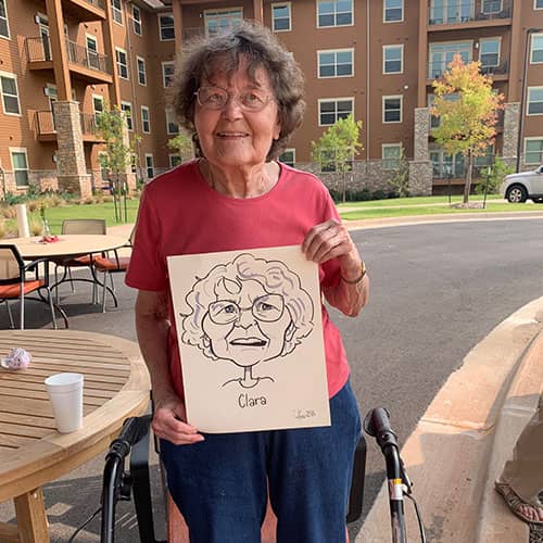 woman holding caricature