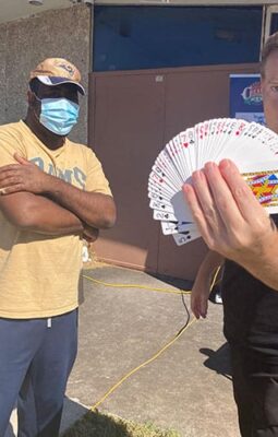 magician holding cards in Edmond Oklahoma