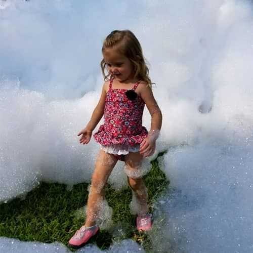 child standing in foam
